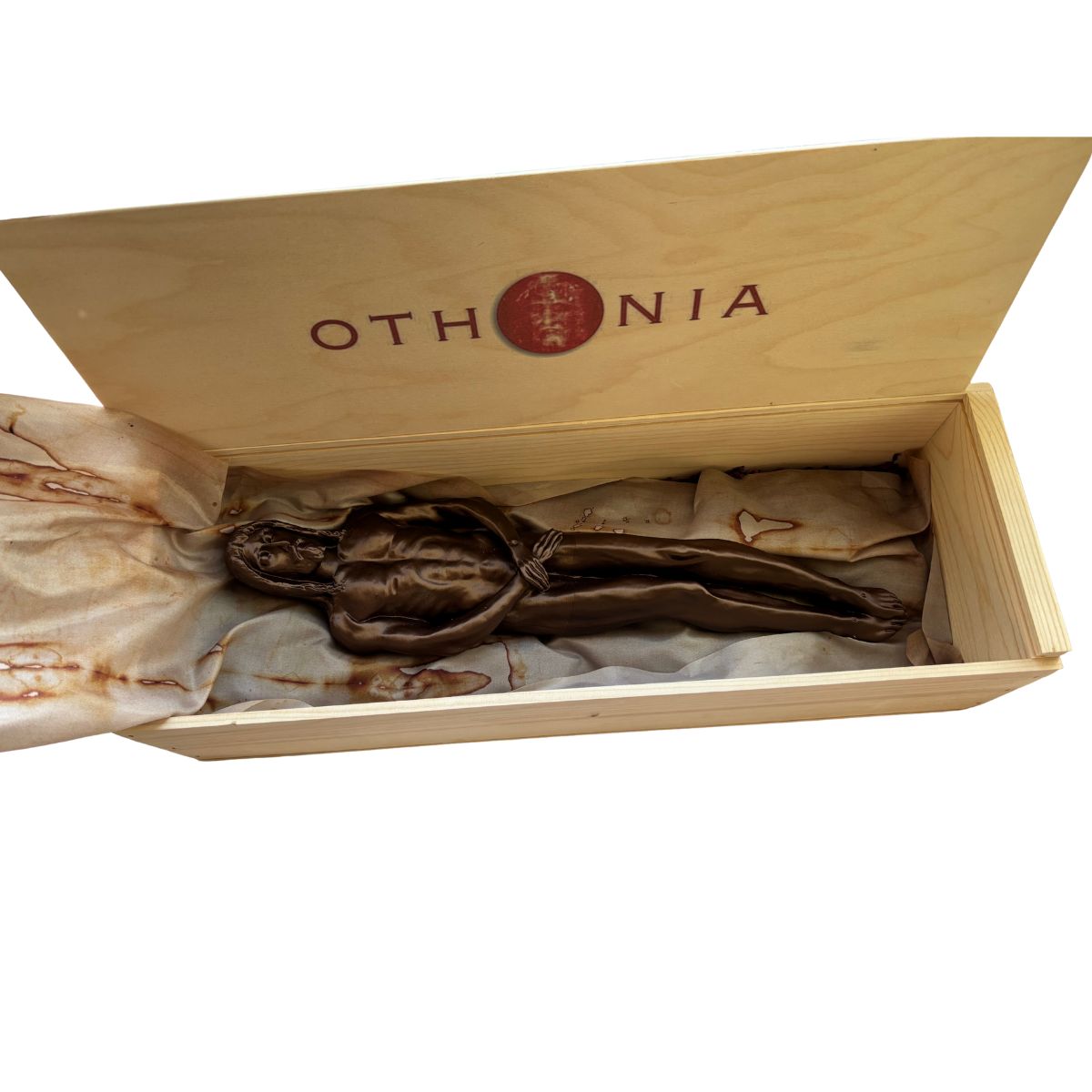 Bronze sculpture inside an open wooden box with 'Othonia' branding.